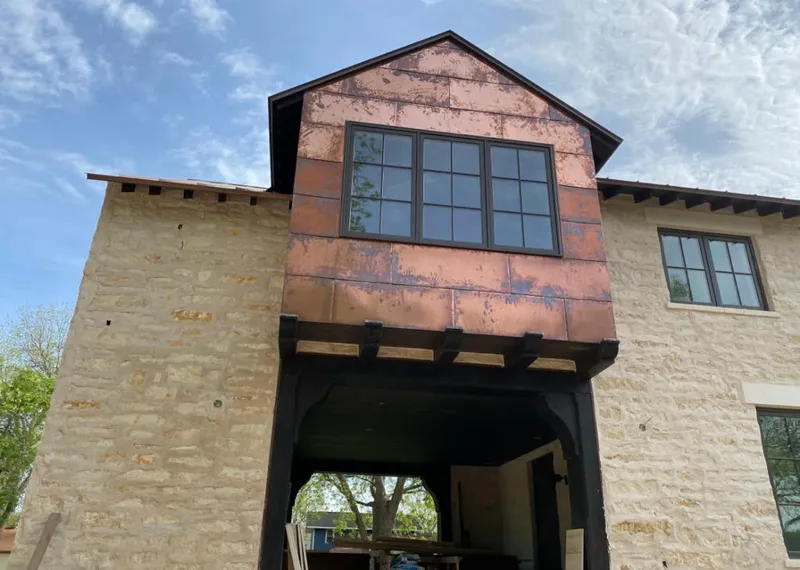 Copper metal panel facade on a stone building for Roof Repair in Harker Heights