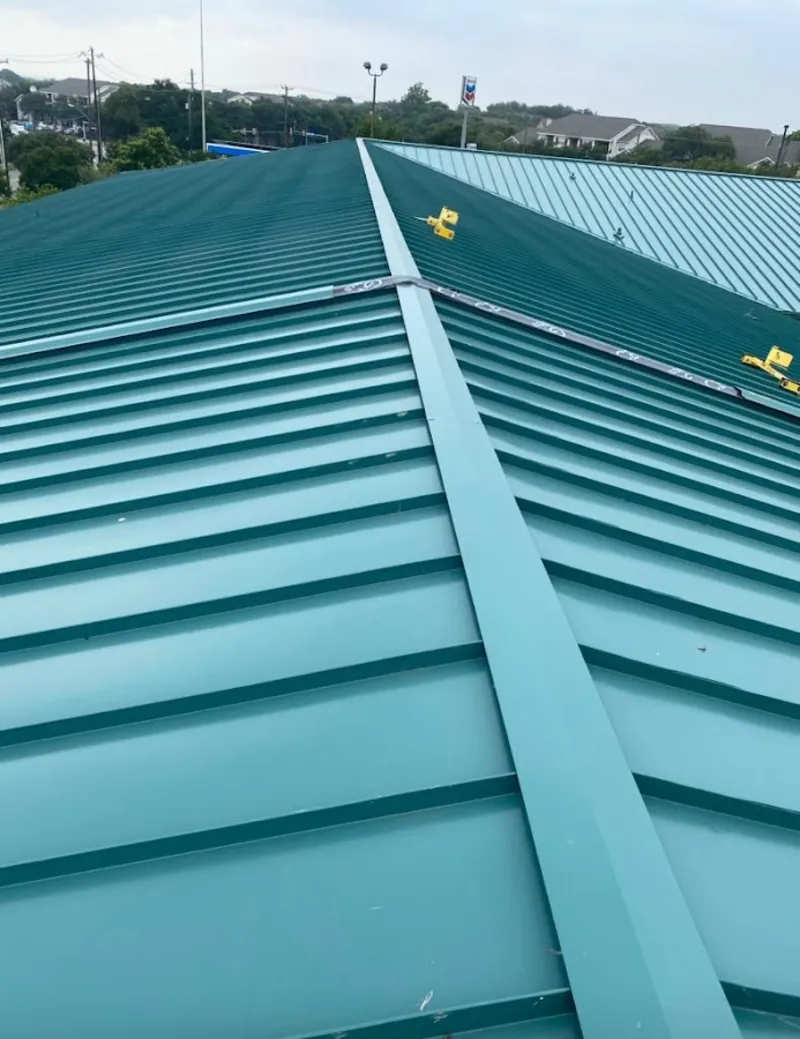 Green commercial metal roof ridge and valley for Metal Roof Repair in Harker Heights